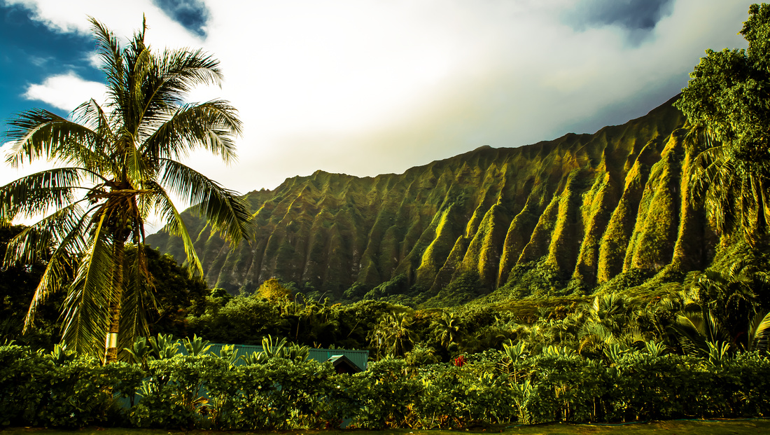 Trailing along the windward side of Oahu, the iconic slopes and valleys of the Ko'olau Mountain Range provide a backdrop to the town of Waimanalo. 